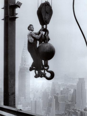 Society Trivia Question: Which building is being constructed by this worker?