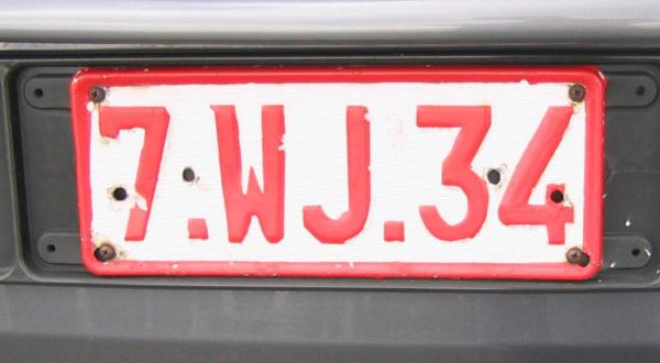 Society Trivia Question: In European countries vehicle registration plates usually have black lettering on a white background. Which country's plates have red lettering?