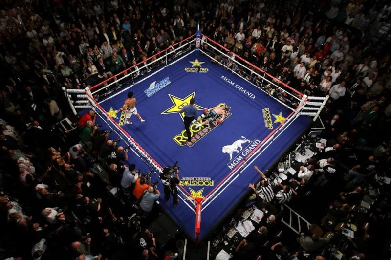 Sport Trivia Question: Today, the boxing ring is actually a square. Was the boxing ring ever a ring?
