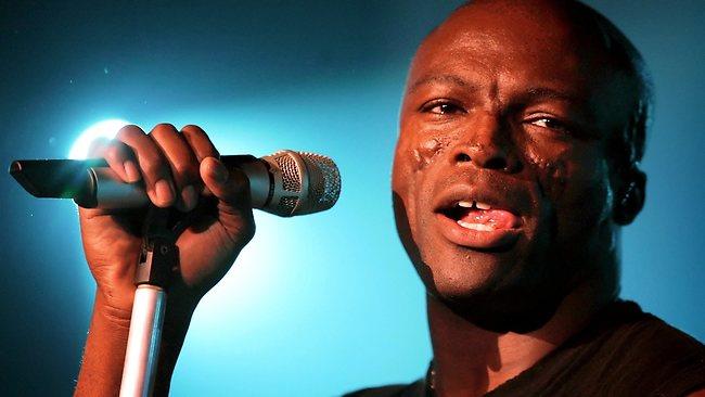 Society Trivia Question: What caused the scars on the face of the singer and songwriter Seal?