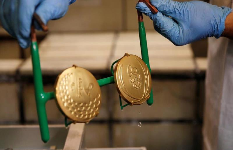 Sport Trivia Question: The winner of an event in the 2016 Summer Olympics receives a gold medal. What percent of the medal is gold?