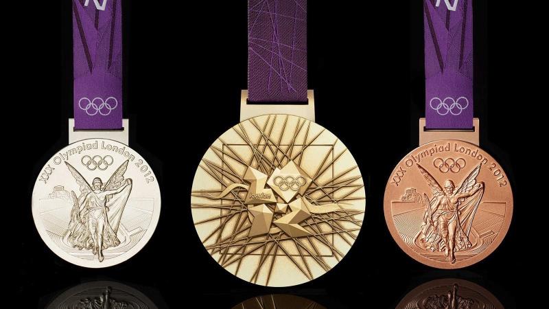 Sport Trivia Question: When was the custom of awarding gold, silver and bronze medals first introduced into the Olympic games?