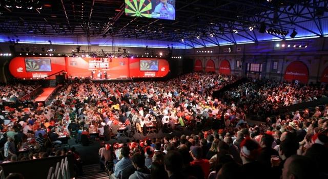 Sport Trivia Question: Who is widely regarded as the best professional darts player of all time winning a record 16 World Championships?