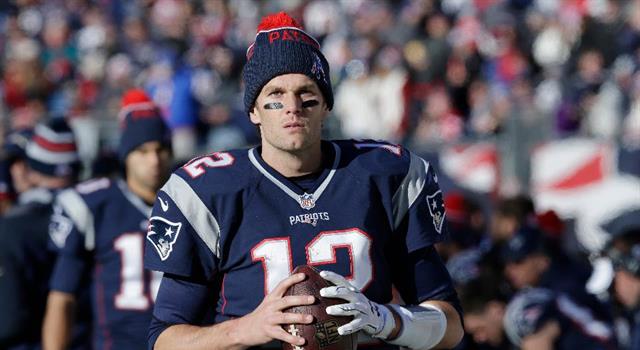 Sport Trivia Question: How many quarterbacks were drafted before Tom Brady in the 2000 National Football League draft?
