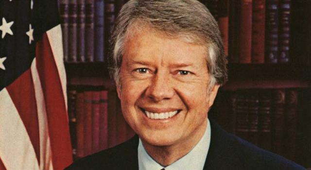 Society Trivia Question: Who assisted Jimmy Carter to tone down his smile?