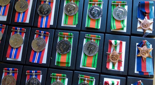 Culture Trivia Question: A medal for gallantry, awarded in 1942, is depicted on which country's flag?