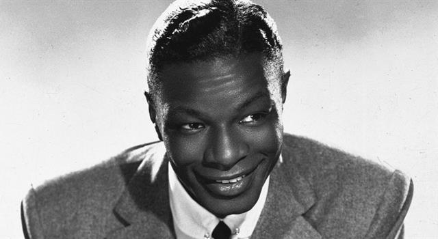 Culture Trivia Question: Which multi-talented person wrote the music to Nat King Cole's hit song 'Smile'?