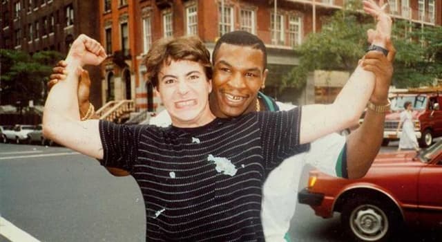 Society Trivia Question: Who is in the picture with Mike Tyson?