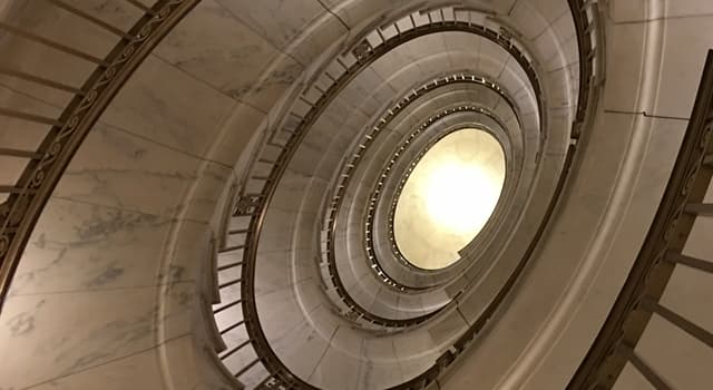 Society Trivia Question: Which United States government building in Washington, DC has a seven spiral staircase depicted in the picture?