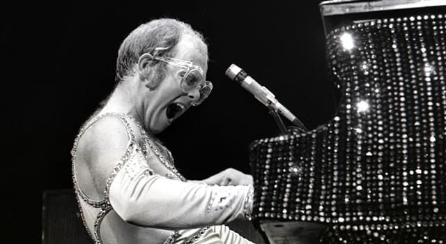 Society Trivia Question: Who made a surprise appearance at Elton John's concert at Madison Square Garden in 1974?