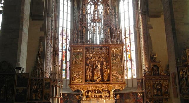 Geography Trivia Question: In which country will you find the world's tallest wooden altar?