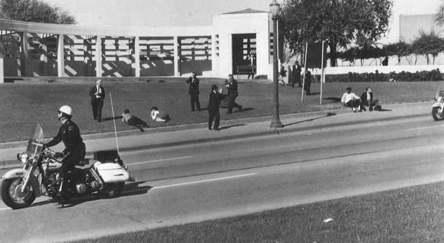 History Trivia Question: What was in the hands of Louie Steven Witt who was suspected in Kennedy's assassination?