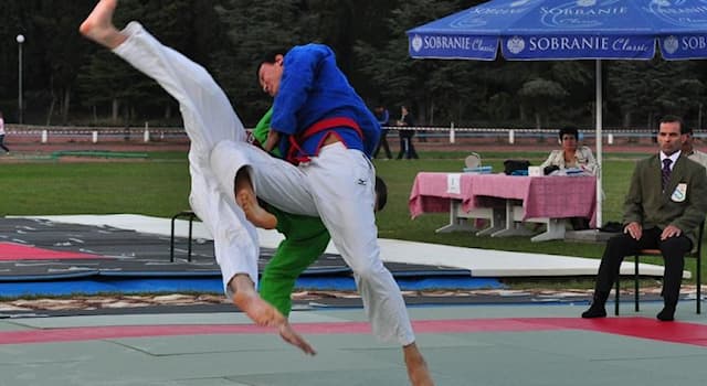 Sport Trivia Question: Which of the following is the folk wrestling style practiced in Central Asia?
