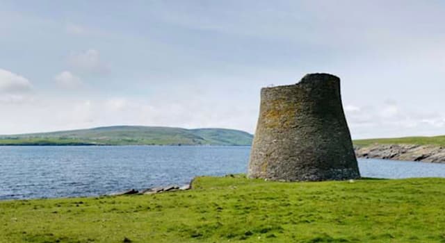 Geography Trivia Question: In which country can this round Iron Age tower be found?