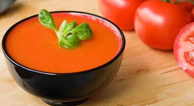 Culture Trivia Question: What is the name of the Spanish traditional cool tomato soup shown in the picture?
