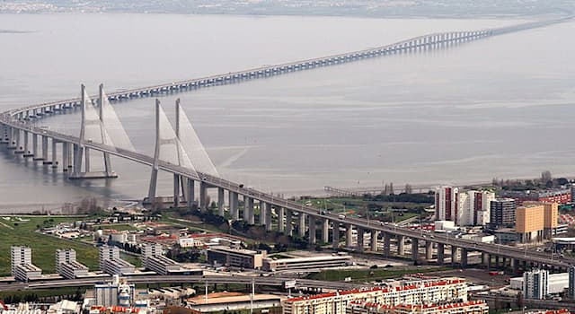 Geography Trivia Question: Which body of water does the Vasco de Gama Bridge span?