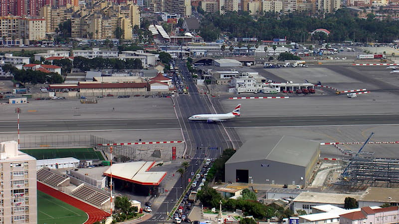 Geography Trivia Question: Gibraltar Airport is one of the strangest airports in the world, why?