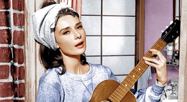 Movies & TV Trivia Question: What song does Audrey Hepburn strum on her guitar in "Breakfast at Tiffany's"?