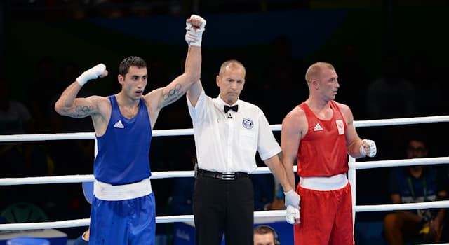 Sport Trivia Question: Boxing referees are mandated to wear which of the following?