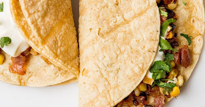 Culture Trivia Question: A Mexican Corn Burrito is a corn tortilla wrapped around what?