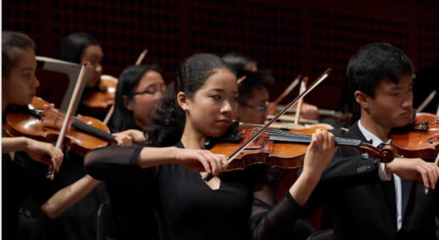 Culture Trivia Question: In music for bowed instruments, what does "col legno" instruct a player to do?