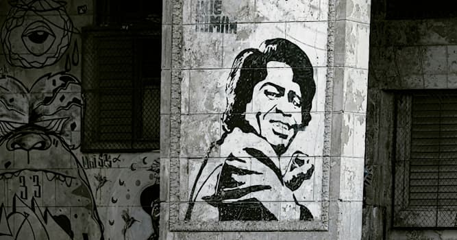 Cultuur Trivia Vraag: Wie wordt er afgebeeld in deze Cubaanse grafitti?