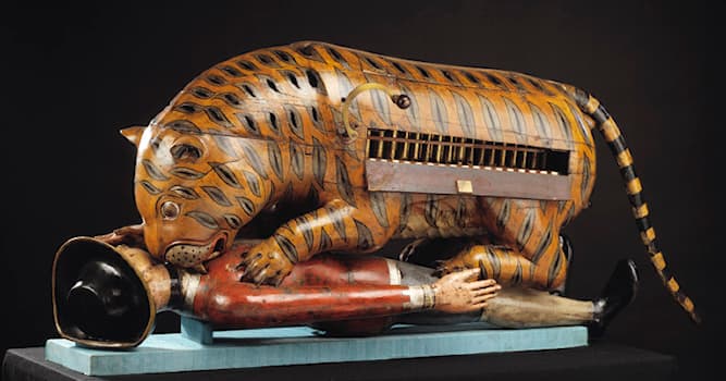 Cultuur Trivia Vraag: Van welk museum in Londen is dit mechanische kunstwerk een van de uithangborden?